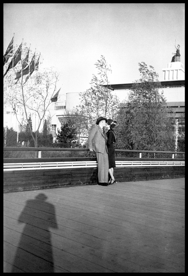 The kiss at the rail, and the photographer's shadow